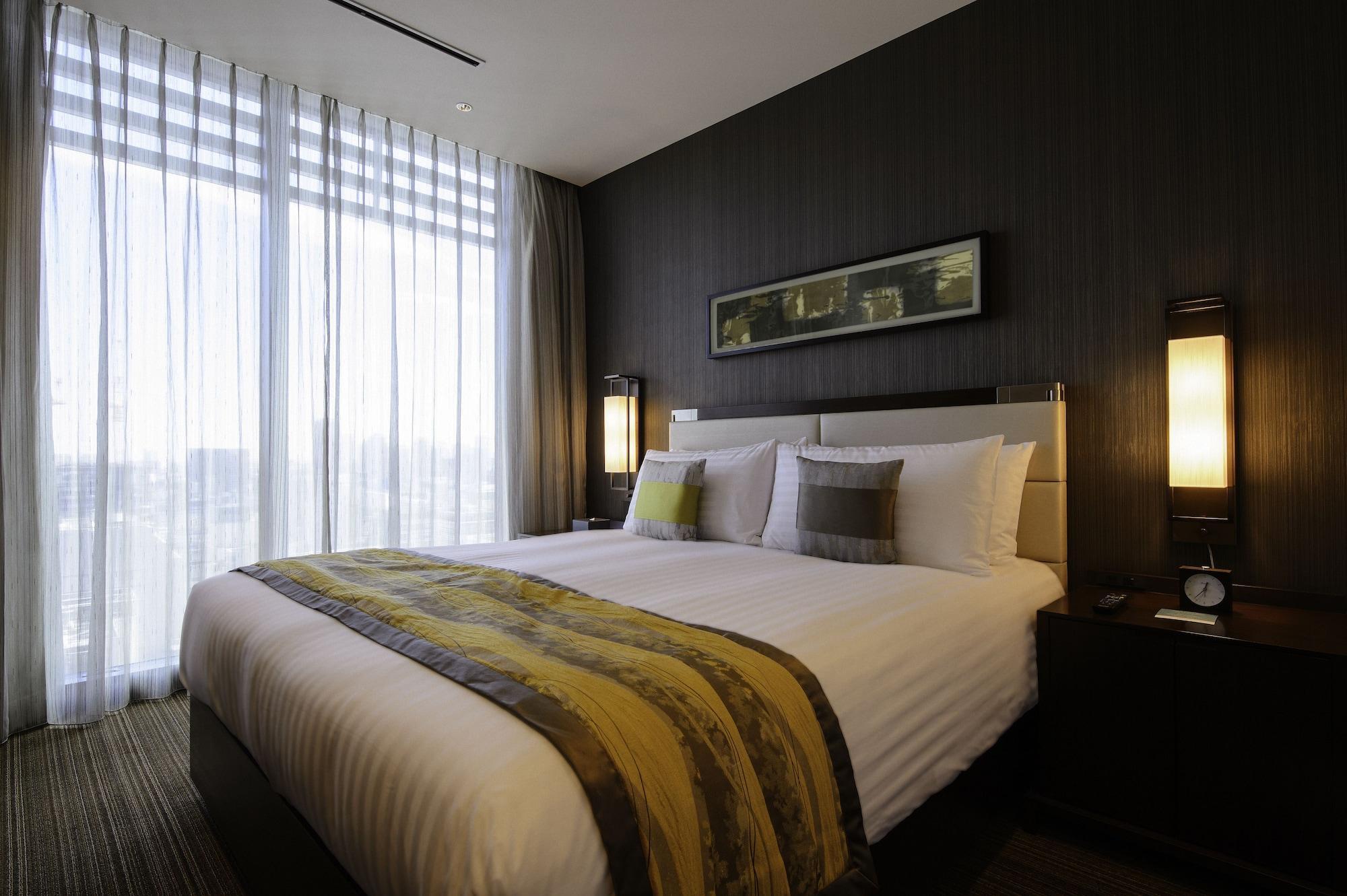 Hotel Oakwood Premier Prefektura Tokio Exteriér fotografie A bedroom at the hotel