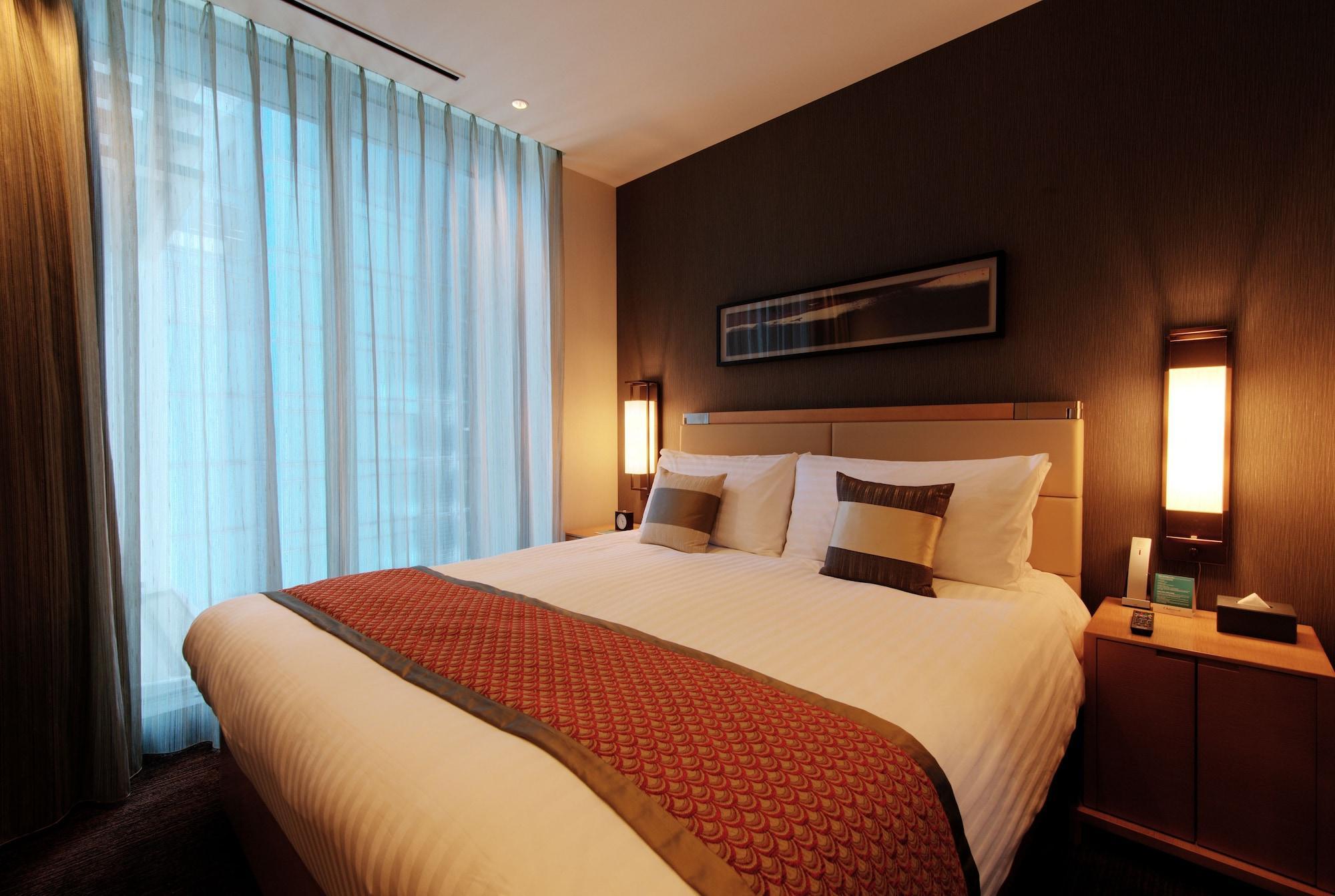 Hotel Oakwood Premier Prefektura Tokio Exteriér fotografie A bedroom in a hotel