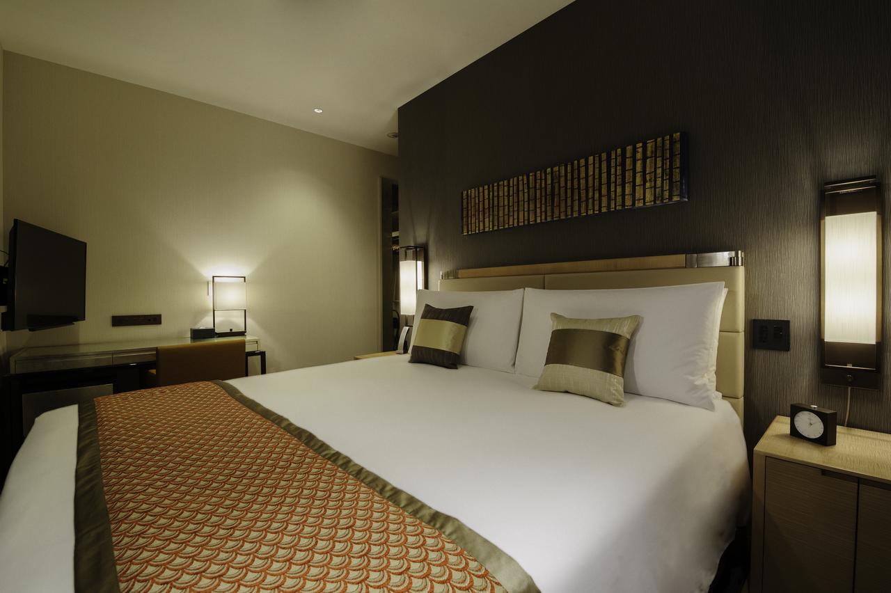 Hotel Oakwood Premier Prefektura Tokio Exteriér fotografie A bedroom at the hotel